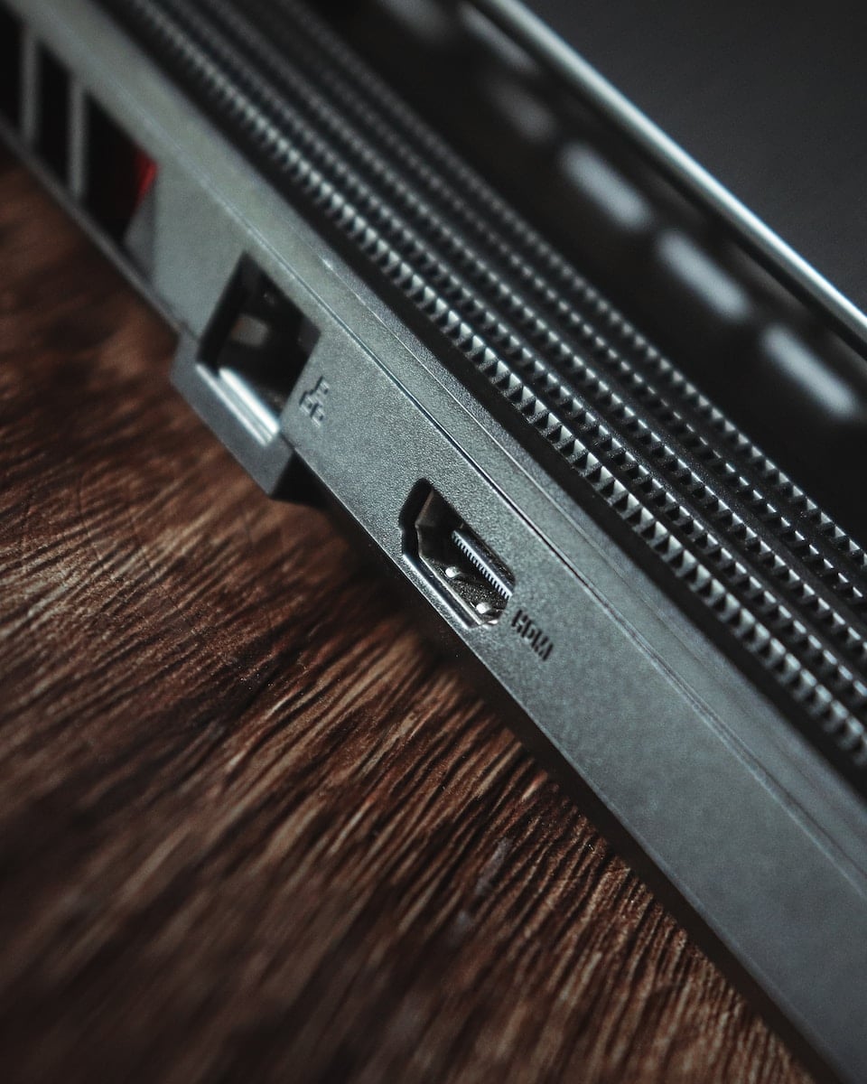 a close up of a laptop on a wooden table